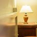 Agriturismo Serafina in Otranto room with bedside lamp and wooden furniture