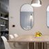 Hotel Al Sole Bardolino dining room with long table, oval mirrors, and pendant light