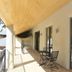 Bon Marie B&B in Hamilton, covered balcony corridor with chairs and railing