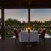 Acoya Curacao Resort, Villas & Spa dining table on a covered deck at sunset in Willemstad