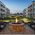 Courtyard by Marriott Chicago Waukegan/Gurnee courtyard with fire pit, seating and guest room balconies in Waukegan