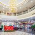 East Garden Hotel Chongqing lobby with grand chandelier, curved balconies and reception area
