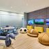 Omni Amelia Island Resort & Spa kids' game room with TVs, football bean bags, and play tables in Fernandina Beach
