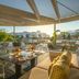 W Algarve in Albufeira: rooftop terrace with dining tables, lounge seating and sunset views
