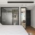 Jo Shtibel Tel-Aviv room with bed, glass-walled bathroom, mirrored closet and wood floors in Tel Aviv