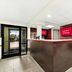 Red Roof Inn & Suites Duncan lobby front desk with entrance doors and guest coffee station