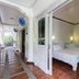 Lanterna Hotel Boracay in Boracay hallway with open guest room showing twin beds
