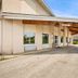 Lakewood Inn & Suites in Dowagiac exterior entrance with covered driveway and parking area
