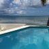 Bravo Beach Hotel in Vieques with oceanfront pool and palm tree view