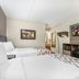 Red Roof Inn Tinton Falls-Jersey Shore room with two beds, desk, TV and wall-mounted shelf in Tinton Falls