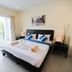 Lamai Buri Resort in Ko Samui bedroom with king bed, balcony doors, and outdoor seating