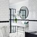 Cape Cadogan Boutique Hotel bathroom in Cape Town with freestanding tub, round mirror and black-and-white tile