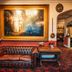 The Bedford Hotel Tavistock lobby with leather sofa, ornate painting and arched doorway