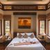 Khaolak Bhandari Resort & Spa in Khao Lak, bedroom with bed, windows and sunset wall art