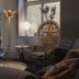 Home Hotel Borgen, Örebro: cozy lounge with wicker chair, sofa, side table, and window seating