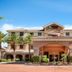 Embassy Suites by Hilton La Quinta Hotel & Spa exterior in La Quinta with palm-lined entrance