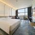 Nova M Olaya Hotel Edge By Rotana room in Riyadh with king bed and city view by large window