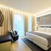 Catalonia Porto guest room in Porto with king bed, large windows, wall-mounted TV and seating area