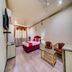 Hotel Ik London Residency Hyderabad room with bed, chairs, TV, and window curtains