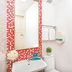 Hotel 81 Kovan in Singapore bathroom with shower, sink, toilet and red mosaic mirror frame