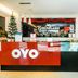 Kenyalang Suite Miri reception desk with Christmas tree and OYO branding