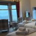St Olaf Golf Hotel Peterhead guest room with two beds and large windows overlooking the landscape
