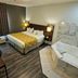 Baymont by Wyndham Chicago/Calumet City room with king bed, desk and corner jetted tub in Calumet City