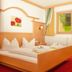 Vital Sporthotel Kristall in Finkenberg guest room with double bed, balcony door, window view, and TV