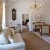 Hotel Chateau Gbelany, Gbelany: elegant suite with chandelier, seating area, fireplace and adjoining bedroom