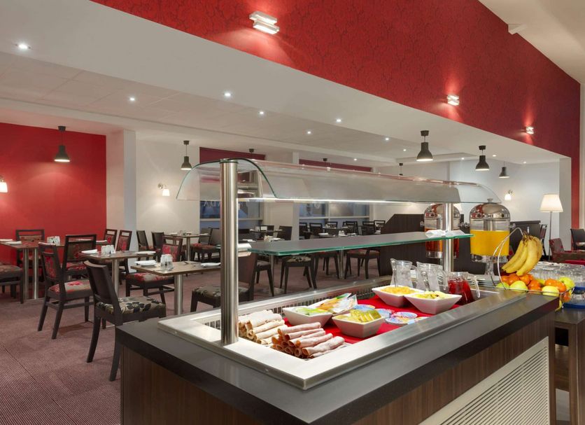 Ramada by Wyndham Wakefield in Ossett breakfast buffet with dining tables and self-serve food stations