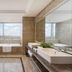 The Longemont Shenyang bathroom with soaking tub, walk-in shower and city view in Shenyang
