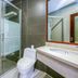 Beifang Langyue Hotel Beijing bathroom with glass shower, toilet and vanity sink