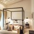Sant Francesc Hotel Singular in Palma de Mallorca, modern four-poster bedroom with sofa and balcony curtains