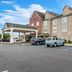 Country Inn & Suites by Radisson Chambersburg, PA exterior with covered entrance and parking lot