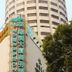 Oasis Tower Shanghai exterior with tall round tower and neon hotel signage