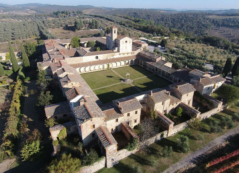 La Certosa di Pontignano in Castelnuovo Berardenga, aerial view of historic stone courtyard and countryside
