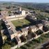 La Certosa di Pontignano in Castelnuovo Berardenga, aerial view of historic stone courtyard and countryside