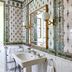 Danesfield House Hotel And Spa bathroom in Marlow with patterned wallpaper, pedestal sink and large mirror
