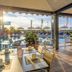 Hotel Panoramic in Caorle outdoor poolside dining terrace with sea view and lounge chairs