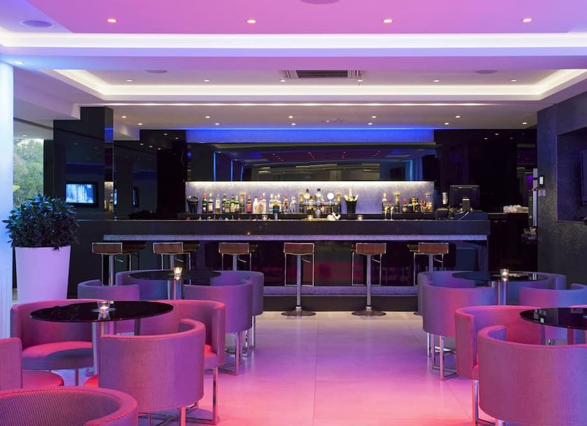 Christofinia Hotel in Ayia Napa bar lounge with purple lighting and round seating