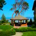 Tigh-Na-Mara Seaside Spa Resort in Parksville with a seaside gazebo, manicured garden and ocean view