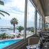 Hotel Antofagasta in Antofagasta dining room with ocean and pool views through large windows