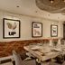 Holmes Hotel London in London dining room with a long set table, framed wall art and woven pendant lights