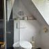 Hotel Saltenhof in Hoerstel bathroom with toilet, glass shower and window under sloped ceiling