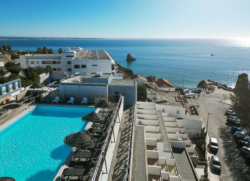 Carvi Beach Hotel in Lagos with a rooftop pool overlooking the ocean and nearby beach