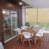 Casas e Quintas de Praia in Aveiro: rooftop terrace with dining table, chairs and glass railing