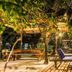 Patrick's on the Beach Resort, General Luna: beachfront cabana with lounge chairs under tropical palms
