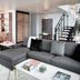 Halcyon - A Hotel in Cherry Creek Denver suite with sectional sofa, dining table and staircase