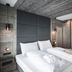 Hirben Naturlaub guest room in Villabassa/Niederdorf with double bed and modern wood-accented design
