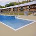 Extended Stay Suites Cookeville - Tennessee Tech pool courtyard with two-story exterior and lounge chairs
